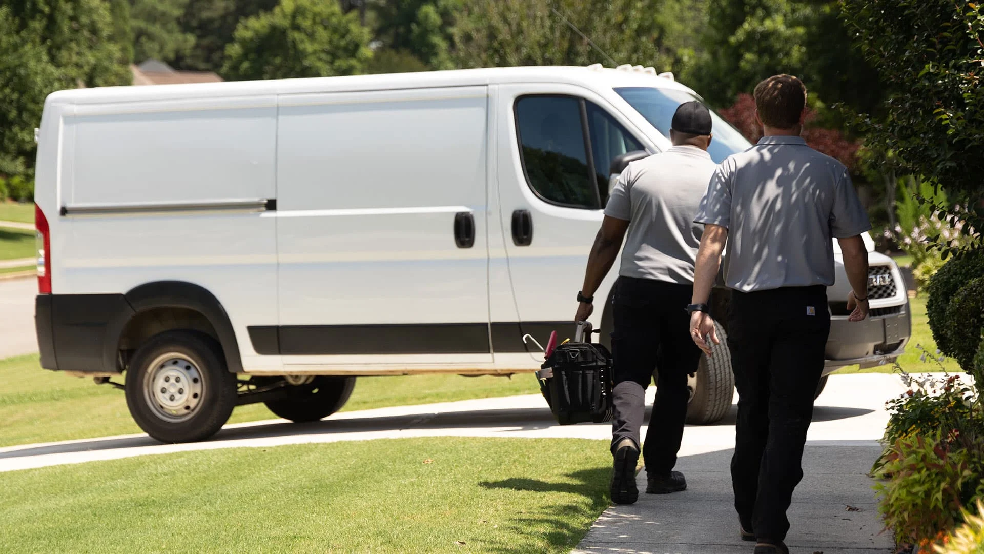 a man and a woman riding on the back of a truck